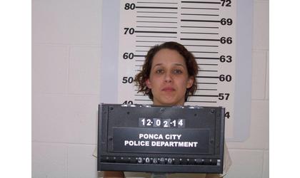 Woman arrested, charged in infant’s 2014 death