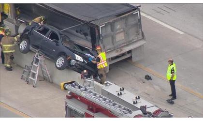 Dump truck  hits Tulsa police car