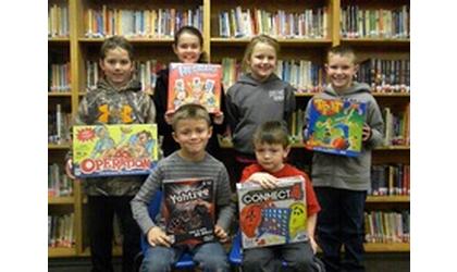 Trout students display reading prizes