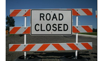 Transmission line down, road closed in Osage County