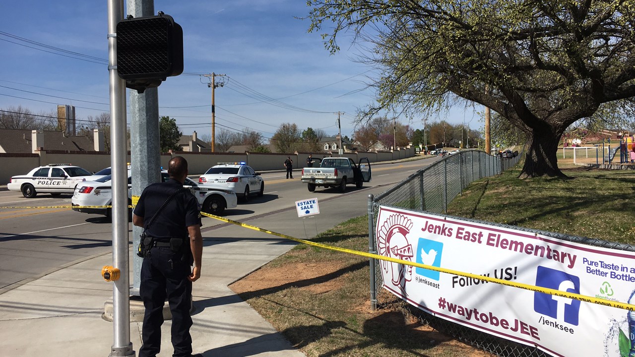 Tulsa officer kills woman with patrol car during gun battle