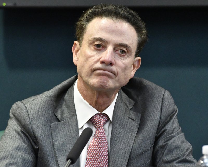 Pitino out as expected amid investigation