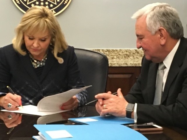 Governor signs bill imposing cuts to Oklahoma agencies