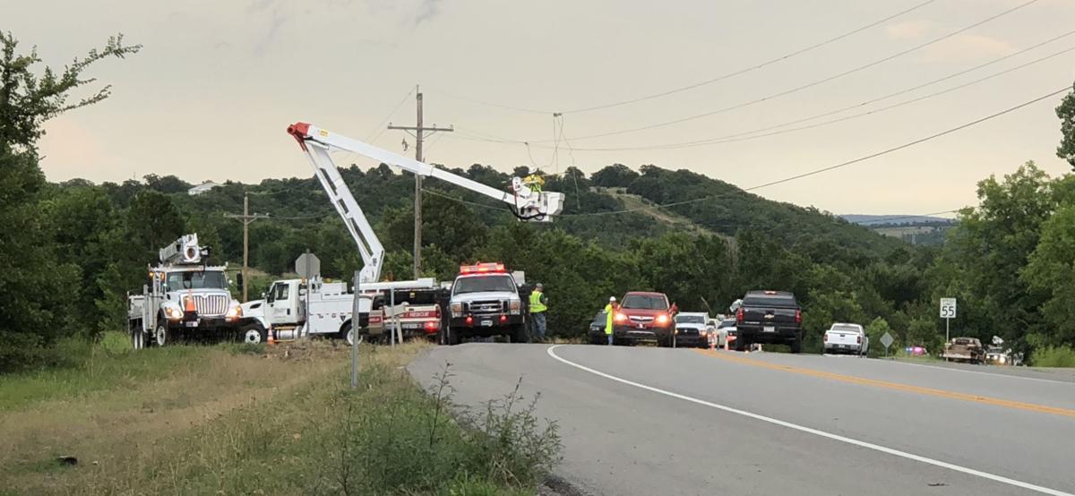 Passenger of semi electrocuted after trying to raise cable line over roadway