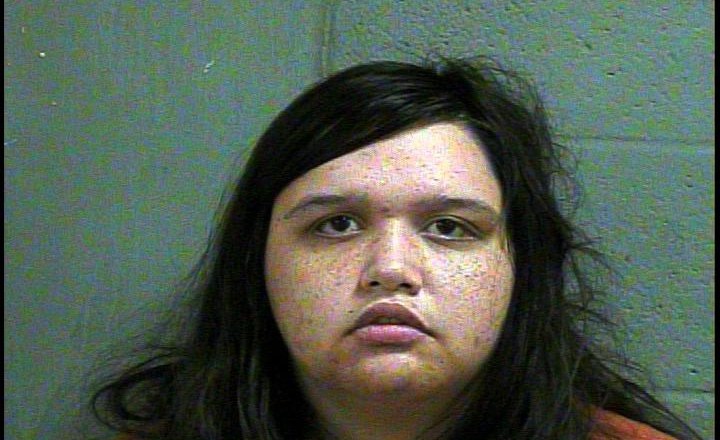 Police say Luther woman tried to hide shooting with fire