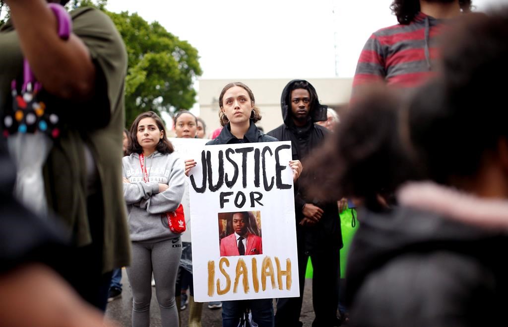 100+ rally to protest fatal police shooting of naked teen